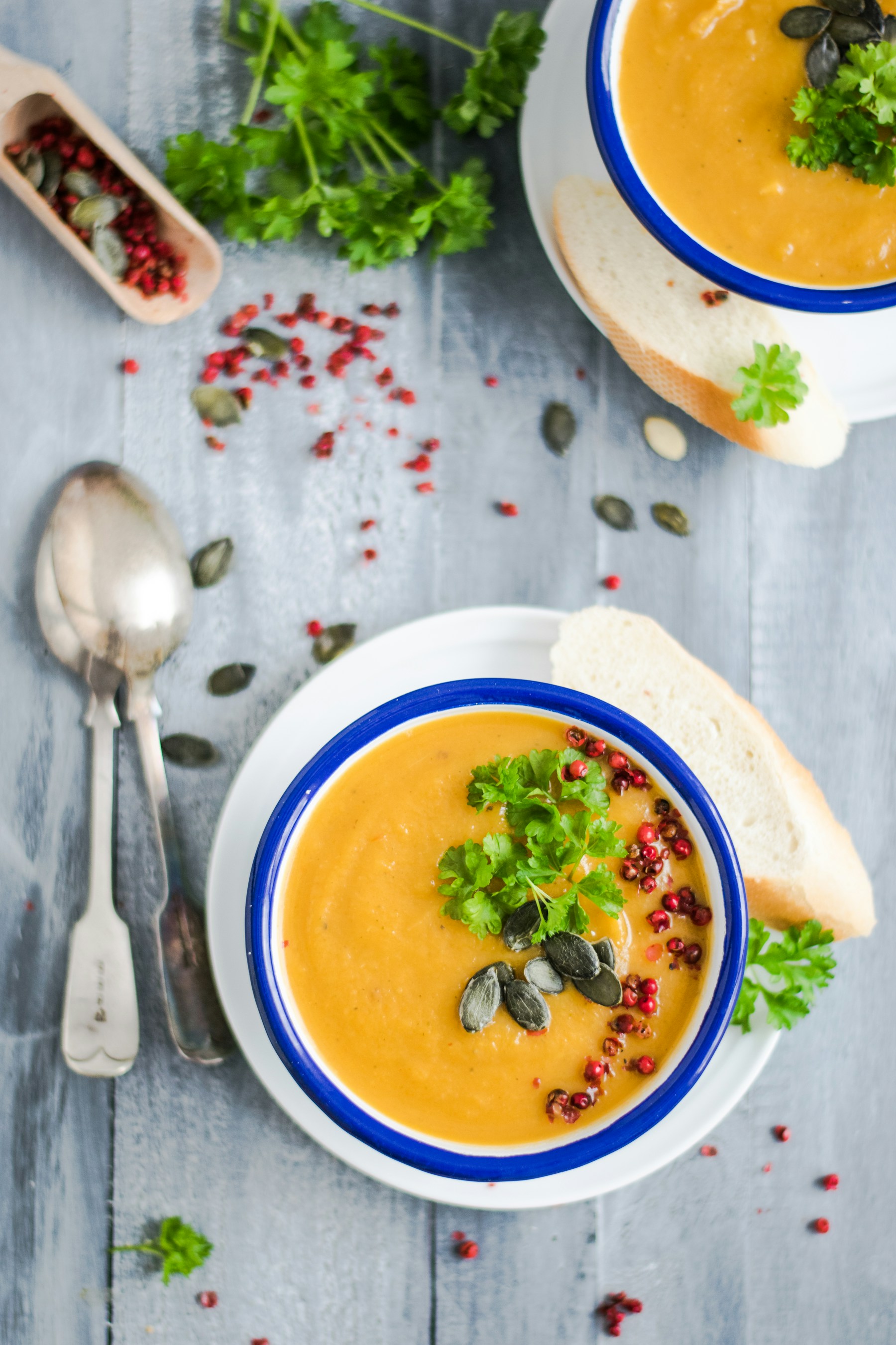 Orange vegetable soup with herbs and seeds